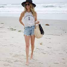 Beach Outfit With Denim Shorts And Graphic Tee Black Sunhat Vacation Outfit See More At Www Herfashionedl Casual Beach Outfit Beach Outfit Women Beach Outfit