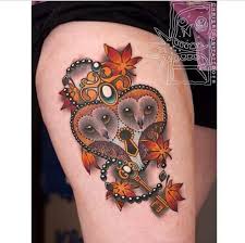 Made by richie bumpkin tattoo artists in trnava, slovakia region. Colorful Barn Owls On Heart Shaped Lock Key With Flowers Tattoo On Thigh