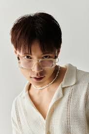 Young Handsome Asian Man Poses Creatively Stock Photos