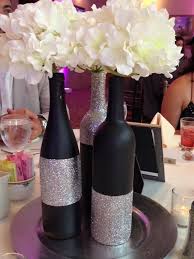 By painting a wine bottle white you emphasize its shape and you give a very interesting look. 28 Wine Bottle Centerpieces For Every Occasion Shelterness