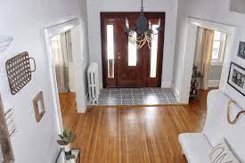 Furniture in an entryway is usually set off the rug. 27 Flooring Ideas For Entryways