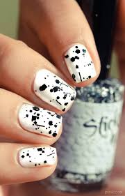 Everyone who loves to work in bright colours or new trendy fashion sense are into nail art. White Short Nails With Black Color Splash Design Nail Art