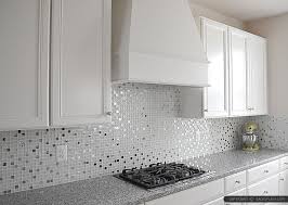 Stands feature faux marble countertops in grey and beige shades, wall units grey, wall tiles imitating brick and marble counters play together with the cabinets creating an amiable ambience. Home Architec Ideas White Cabinet Kitchen Tile Backsplash Ideas