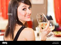Woman drinking glass wine hi-res stock photography and images
