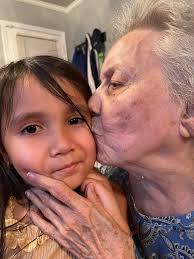 An earlier photo of Nellie with her grandfather. ?