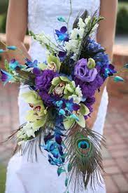 Creating professional flower arrangements, unique displays and wedding flower arrangements for over 20 wedding bouquets. Pin By Ann Petty On My Wedding Peacock Wedding Flowers Wedding Bouquets Flower Bouquet Wedding