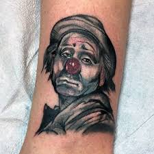 The clown skull tattoo is a usual tattoo design, but the way this skull face is brought out is the highlight and challenge for the designers to ink them. 75 Clown Tattoos For Men Comic Performer Design Ideas