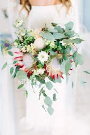 Here Are A Few Of The Very Best Tips On How You Can Find Less Expensive Wedding Flowers Without Breaking Th Red Wedding Flowers Protea Wedding Wedding Bouquets