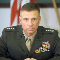 Maj. Harold Nicely speaks to Soldiers after taking