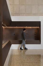 南京长江大桥桥头堡室内展陈设计 反几 land studio 谷德设计网 central hall open cabinets lighted bathroom mirror