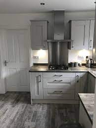 The worktop is made of travertine. Jackson Pine Worktop Dove Grey Shaker Doors Shaker Style Kitchen Cabinets Grey Shaker Kitchen Kitchen Cabinet Trends