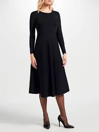 As if from a movie, you move through the room with an alluring look in your eye, your little black fit and flare dress looking timeless and tempting. John Lewis Knitted Fit And Flare Dress Black At John Lewis Partners