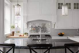 Arabesque tile backsplashes are becoming a popular trend for kitchens and bathroom wall tiles. Mirrored Arabesque Kitchen Tiles Transitional Kitchen