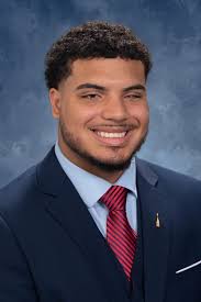 Devoted to service, grad wins St. John's top honor