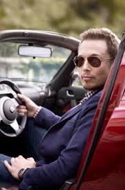 Elon Musk Sitting In His Roadster Homens