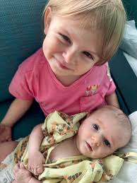 She held her daughter in her arms moments after receiving her Master's  degree. It was last Friday, and 31-year-old Rachel Easterly and her husband  Adam posed for pictures outside Coleman Coliseum in