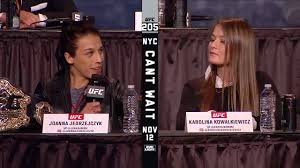 Joanna jedrzejczyk (red gloves) reacts after defeating karolina kowalkiewicz (blue gloves) in their strawweight title bout during ufc 205 at madison square garden. Ufc Ufc 205 Jedrzejczyk Vs Kowalkiewicz Facebook