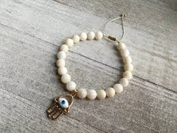 Maybe you would like to learn more about one of these? Cats Eye Hand Of Hamsa Evil Eye Bracelet Etsy Evil Eye Bracelet Hamsa Evil Eye Charm