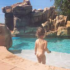 Naked in backyard pool