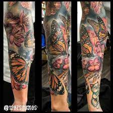 Incredible Full Sleeve Tattoo Featuring Monarch Butterflies And A Floral Background By Meghan Pat Monarch Butterfly Tattoo Full Sleeve Tattoos Butterfly Tattoo