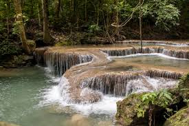 Erawan waterfalls lies inside the erawan national park and runs right next to khwae yai river. Erawan Falls National Park Of Kanchanaburi Thailand Indivstock