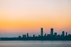 Join us for a cool evening out on town lake to watch the sun say goodnight to the austin skyline! City Skyline And Sea At Sunset Mumbai India By Alejandro Moreno De Carlos