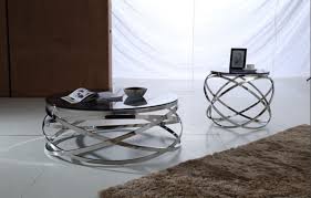 Round glass top of this element looks very interesting and provides support for food and drinks. Tulare 3pc Smoked Glass Coffee Table Set