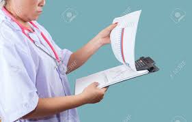 Doctor Checking On Clipboard For Patient Chart Healthyconcept