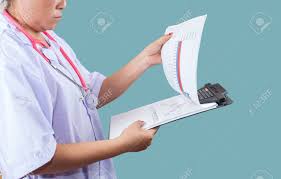 doctor checking on clipboard for patient chart healthyconcept