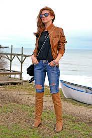 Women S Brown Leather Bomber Jacket Black Crew Neck T Shirt Blue Ripped Skinny Jeans Brown Leather Knee High Boots Brown Leather Jacket Outfit Brown Leather Bomber Jacket Leather Jacket