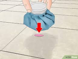 Combine equal parts of bleach and water and pour onto the slabs. 3 Ways To Remove Stains From Tiles Wikihow
