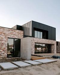 I Show A Lot Of Our Recycled Brick But A Lot Of Our Exterior Also Features Colourbond Cladding In Matt M Brick Exterior House House Cladding Modern Brick House