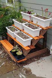Need Some Ideas To Display Your Plants Indoor And Outdoor Here You Go We Have Listed A Lot Of Eas Plant Stands Outdoor Outdoor Plants Backyard Garden Layout