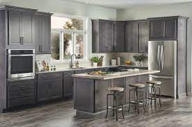 Home Upgrades With The Highest Increase In Home Value Stained Kitchen Cabinets Laminate Flooring In Kitchen Kitchen Design