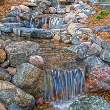 A curved bluestone water wall would definitely become a focal point of any backyard. Pondless Water Features Denver Art Of The Yard