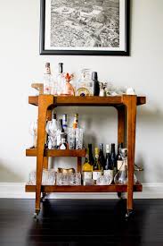 6 Practical Must Haves For Your Bar Cart Heather Bien Bar Cart Decor Wooden Bar Cart Vintage Bar Carts