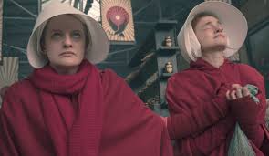 Women in red capes and white bonnets walk in rows, elisabeth moss runs away from shadowy figures in the. The Handmaid S Tale Season 3 Everything We Know So Far Glamour