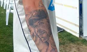 A womb tattoo, or inmon 淫紋 (lit lewd crest or sexual demon tattoo), is a tattooed crest or magical rune located on a character's crotch or lower stomach that, as a trope, indicates sexual power emanating from or being forced upon the character. Matthew Wade Unveils Phillip Hughes Tattoo After Victoria Win Australian Domestic Sheffield Shield Competition Daily Mail Online