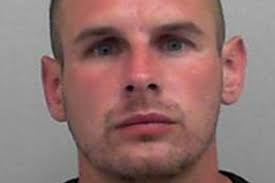 Fugitive trolls police over unflattering mugshot