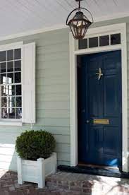 Modern white farmhouse exterior with dark blue and glass front door. 16 Grey Exterior Blue Door Ideas Front Door Colors Door Color House Colors