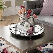 Beautiful fresh flowers arrangement decorating buffet table, trays and plates with homemade baked cakes and biscuits sprinkled. Willa Arlo Interiors Mirrored Vanity Tray Coffee Table Decor Tray Mirror Tray Decor Mirror Vanity Tray