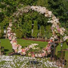 Learn how to diy a flower doorway arch! How To Design And Flower A Circle Wedding Arch