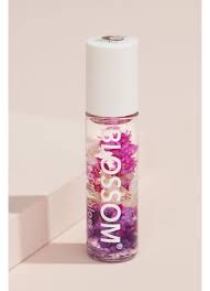 Infused with natural dried flowers for a pop of color, this lip gloss rolls on clear and features a light floral scent. Scented Flower Infused Lip Gloss David S Bridal