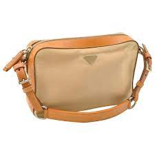 In this way, vintage shopping is a lot like buying plane tickets. Prada Vintage Nylon Shoulder Bag Beige Leather Ref 159497 Joli Closet