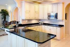 The kitchen features white cabinets, black countertops, black hardware. 36 Inspiring Kitchens With White Cabinets And Dark Granite Pictures Home Stratosphere