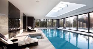 Considering an indoor swimming pool? Luxury Indoor Swimming Pool Design Installation Company Based In Surrey Winner Of Master Pools Guild Awards For Design Call Now 01932 Pool House Designs Luxury Swimming Pools Pool Houses