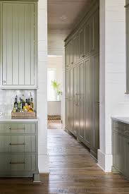 Hidden behind the cabinet doors to the right of the fridge is an appliance garage wrapped in the same quartzite. Floor To Ceiling Kitchen Cabinets Design Ideas