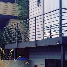 Let the natural color of the wood stated its beauty, which good together with the wooden deck and the wall. Home Railing Design