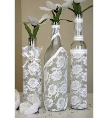 One Decorated Wine Bottle Centerpiece White Lace Por Dazzlinggrace 20 00 Wine Bottle Centerpieces Bottle Centerpieces Wine Bottle Decor