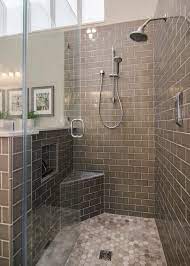 Marble basketweave shower floors unite with light gray subway tile walls displayed through a seamless glass shower. Walk In Shower With Gray Subway Tile Hgtv